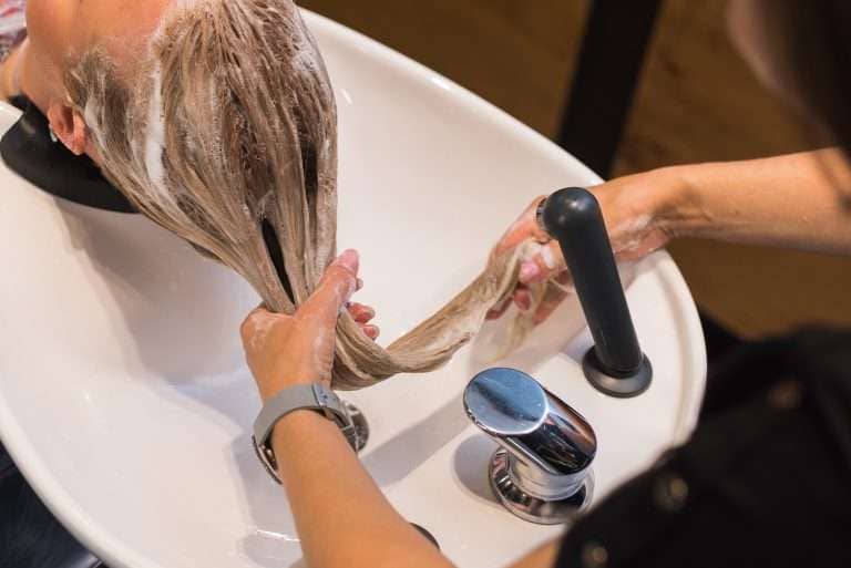 Hairdresser Washing Clients Hair with Soft Water Provided by Indy Soft Water