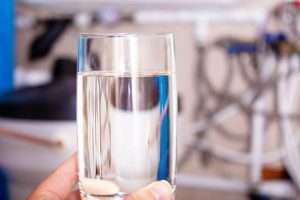 Blog 9 Clean water glass in hand. Water softening.