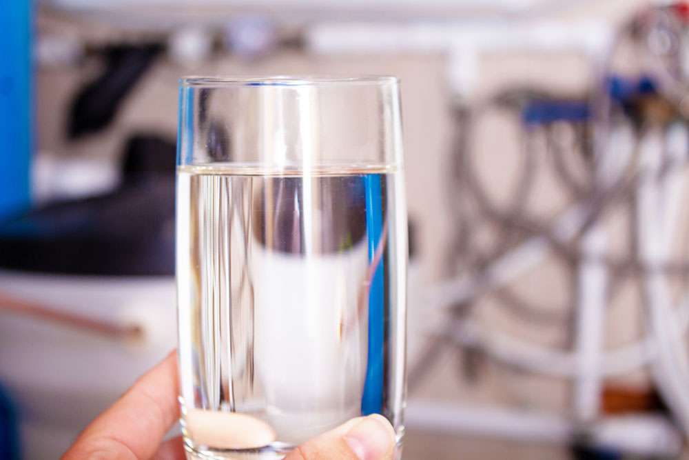 Knowing When to Replace Resin in Water Softener Systems 1 Clean water glass in hand. Water softening.